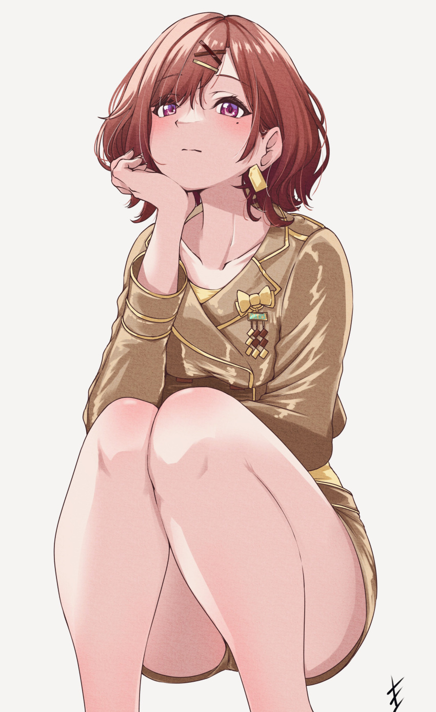 1girl, absurdres, bangs, bare_legs, blush, brown_hair, collarbone, earrings, end_mha, gold_jacket, hair_ornament, hairclip, hand_on_own_chin, highres, higuchi_madoka, idolmaster, idolmaster_shiny_colors, jewelry, long_sleeves, looking_at_viewer, mole, mole_under_eye, short_hair, simple_background, solo, thighs, violet_eyes, white_background, x_hair_ornament