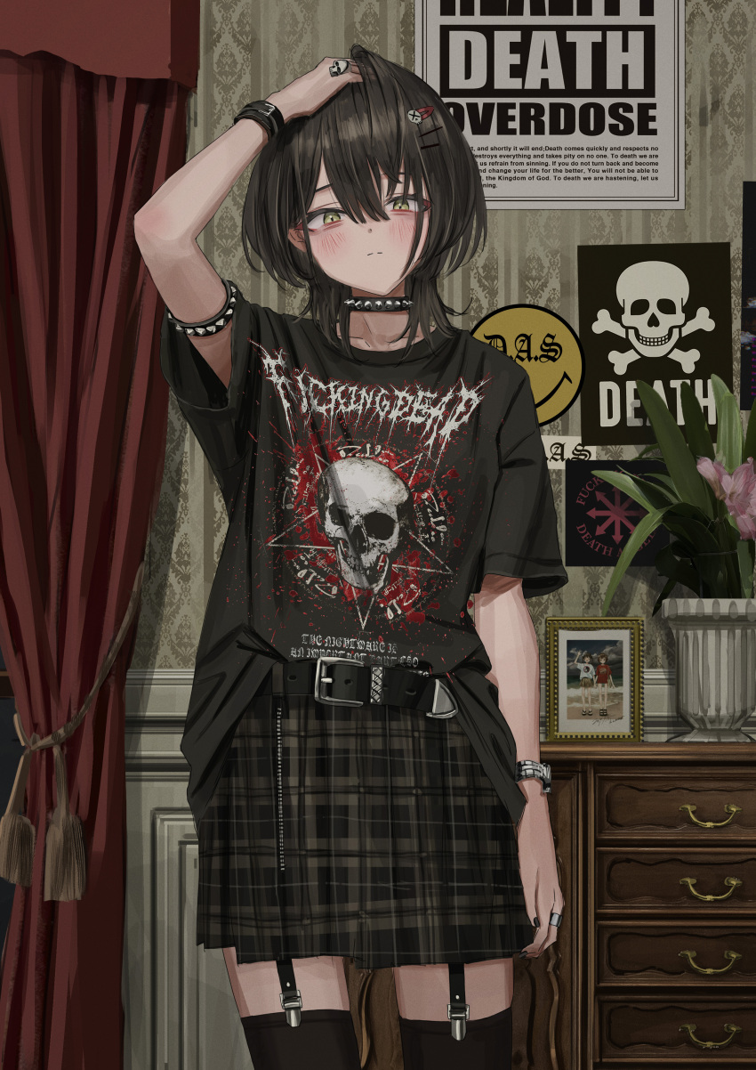 1girl, absurdres, arm_at_side, arm_up, armlet, bangs, belt, black_hair, black_legwear, black_shirt, black_skirt, blush, bracelet, choker, crossed_bangs, curtains, emo_fashion, english_text, flower_pot, garter_straps, gothic, green_eyes, hair_between_eyes, hair_ornament, hairclip, hand_in_own_hair, highres, indoors, jewelry, looking_at_viewer, medium_hair, nadegata, original, photo_(object), picture_frame, plaid, plaid_skirt, plant, pleated_skirt, poster_(object), potted_plant, ring, shirt, shirt_partially_tucked_in, skirt, skull, solo, spiked_armlet, spiked_choker, spikes, split_mouth, tassel, thigh-highs, wallpaper_(object), watch