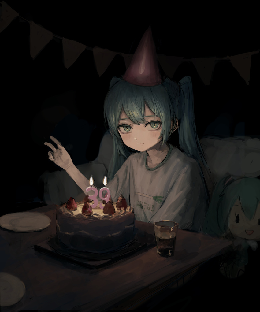 1girl, absurdres, alternate_costume, aqua_eyes, aqua_hair, bangs, birthday_cake, birthday_party, cake, candle, casual, character_doll, closed_mouth, clothes_writing, commentary_request, cup, dark, drinking_glass, food, hat, hatsune_miku, highres, indoors, long_hair, looking_at_viewer, party_hat, plate, sakiika0513, shirt, short_sleeves, sitting, smile, solo, spring_onion, strawberry_cake, t-shirt, table, twintails, v, vocaloid