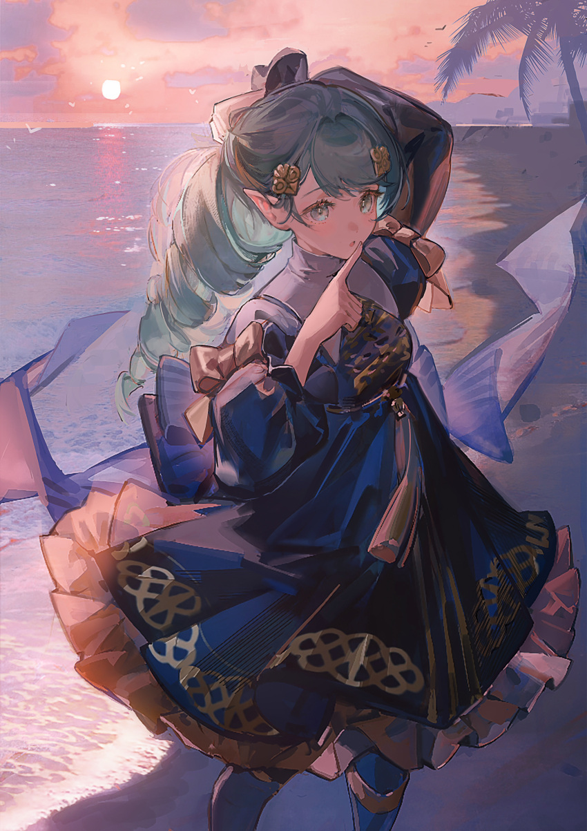 1girl, absurdres, animal, bangs, beach, bird, black_dress, black_footwear, clouds, commentary, dress, drill_hair, english_commentary, fire_emblem, fire_emblem:_three_houses, flayn_(fire_emblem), flying, green_eyes, green_hair, hair_ornament, highres, index_finger_raised, long_hair, looking_at_viewer, neriash, ocean, orange_sky, outdoors, palm_tree, pointy_ears, sand, sky, solo, sun, swept_bangs, tree, water