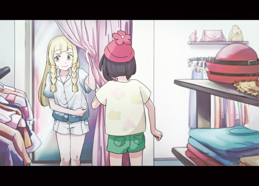 2girls, beanie, black_hair, blonde_hair, blue_skirt, changing_room, from_behind, green_shorts