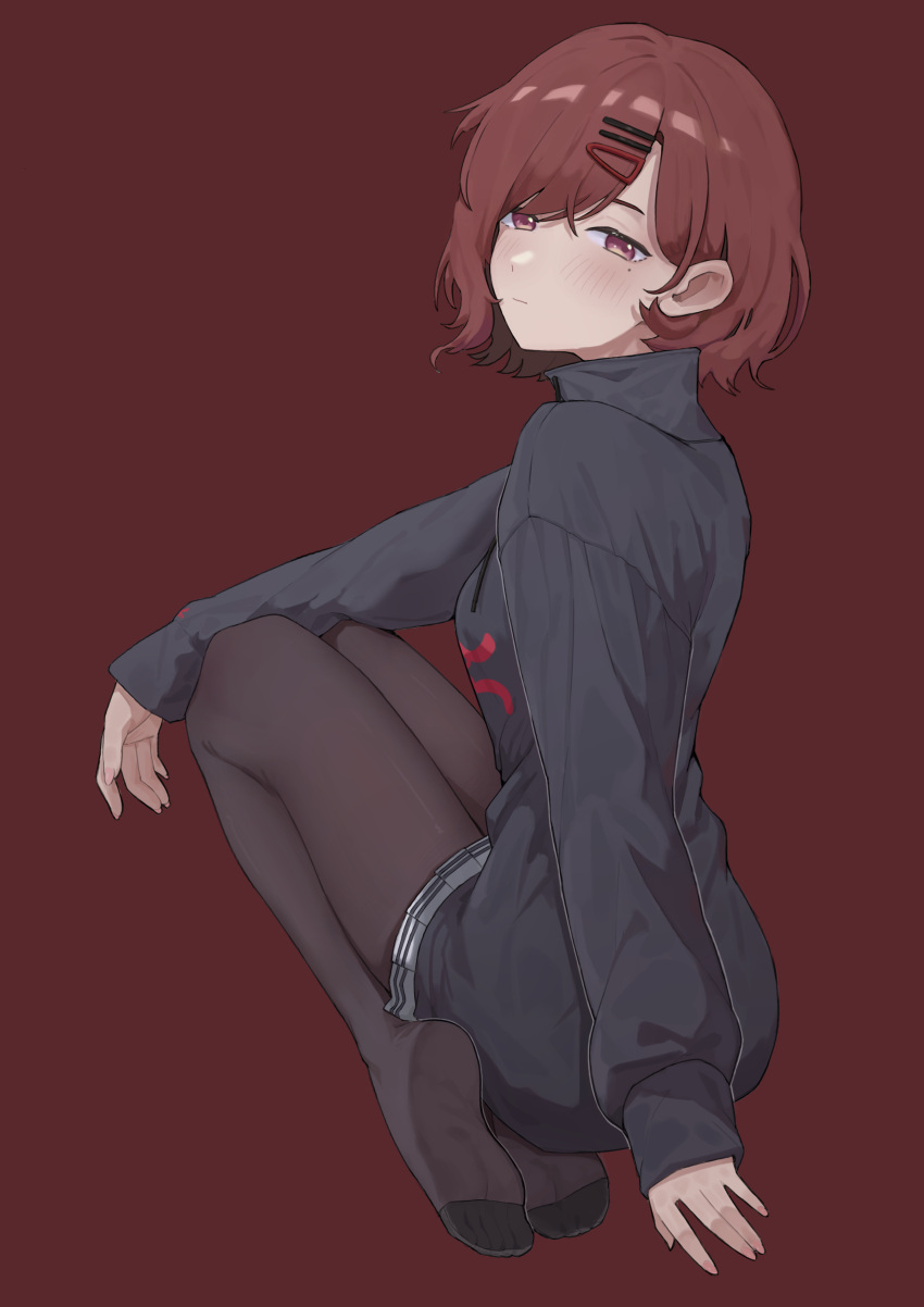 1girl, absurdres, black_pantyhose, black_shirt, blush, brown_hair, highres, higuchi_madoka, idolmaster, idolmaster_shiny_colors, long_sleeves, looking_at_viewer, looking_back, mole, mole_under_eye, namae_kunn, no_shoes, pantyhose, plaid, plaid_skirt, pleated_skirt, red_background, red_eyes, shirt, short_hair, simple_background, skirt, solo