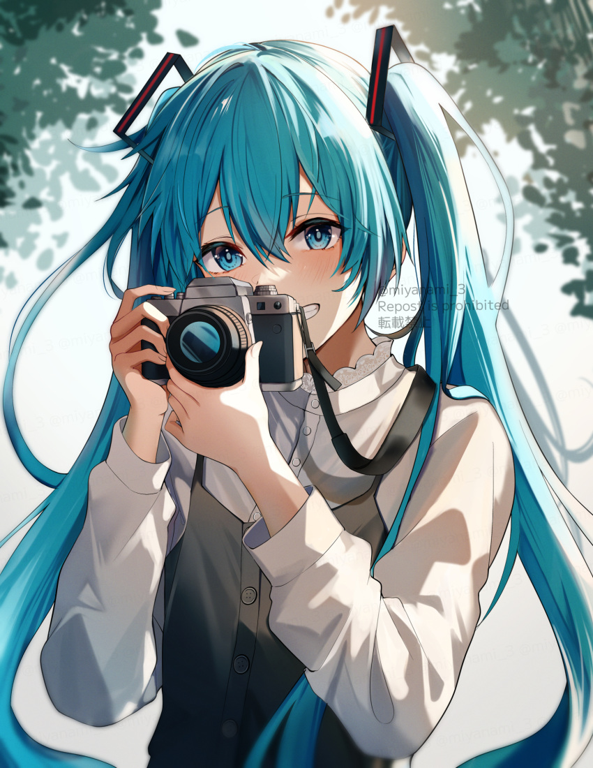 1girl, aqua_eyes, aqua_hair, camera, grey_shirt, hair_ornament, hatsune_miku, highres, holding, holding_camera, long_hair, long_sleeves, noizu_(noi_hr), overalls, shirt, smile, solo, teeth, twintails, twitter_username, very_long_hair, vocaloid