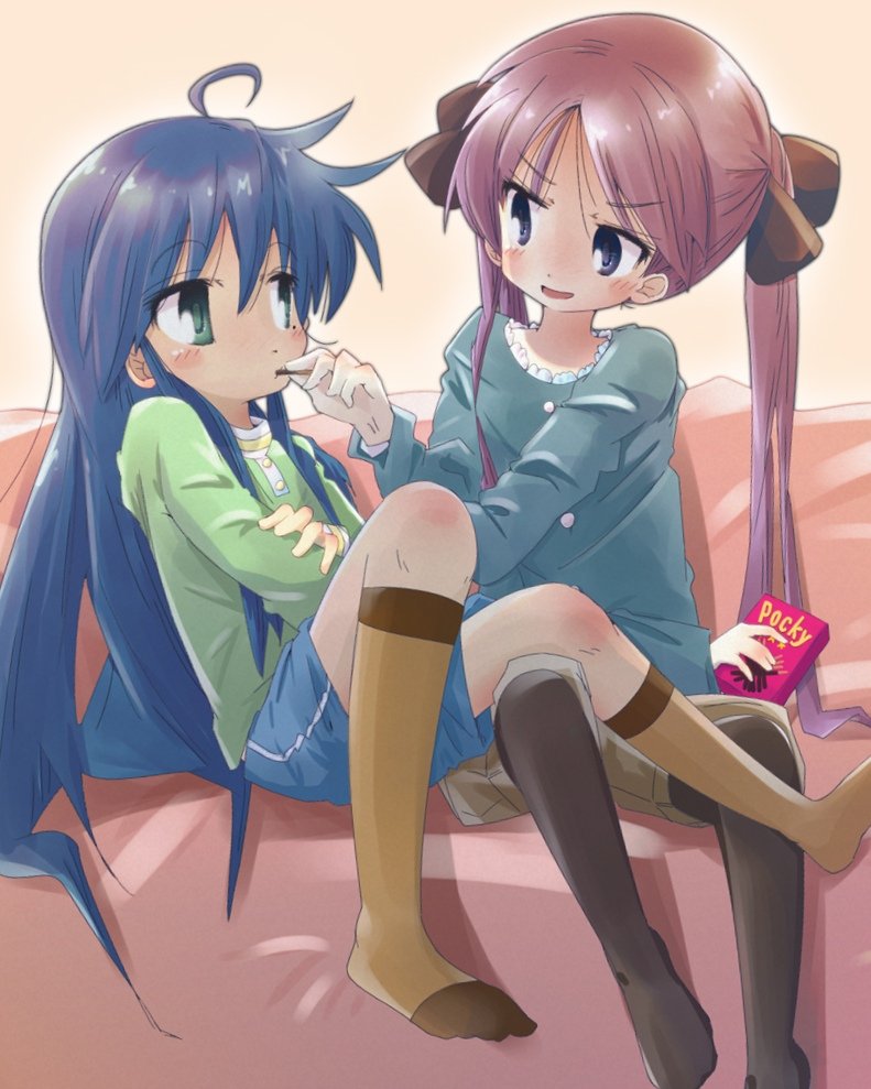 2girls, blue_hair, blush, couch, food, green_eyes, hair_between_eyes, hiiragi_kagami, izumi_konata, lucky_star, mole, mole_under_eye, multiple_girls, nirata_masoba, open_mouth, pocky, purple_hair, shorts, sitting, yuri