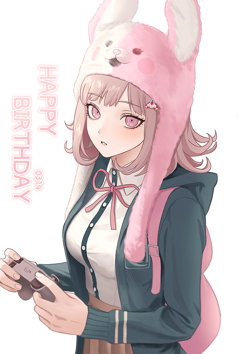 1girl, alternate_costume, backpack, bag, breasts, brown_hair, collared_shirt, controller, danganronpa_(series), danganronpa_2:_goodbye_despair, dated, flipped_hair, green_jacket, hair_ornament, happy_birthday, hat, highres, holding, holding_controller, hood, hooded_jacket, jacket, kirara_(kiraronpa), long_sleeves, looking_at_viewer, medium_hair, nanami_chiaki, neck_ribbon, parted_lips, pink_bag, pink_eyes, pink_ribbon, ribbon, shirt, skirt, solo, teeth, usami_(danganronpa), white_shirt