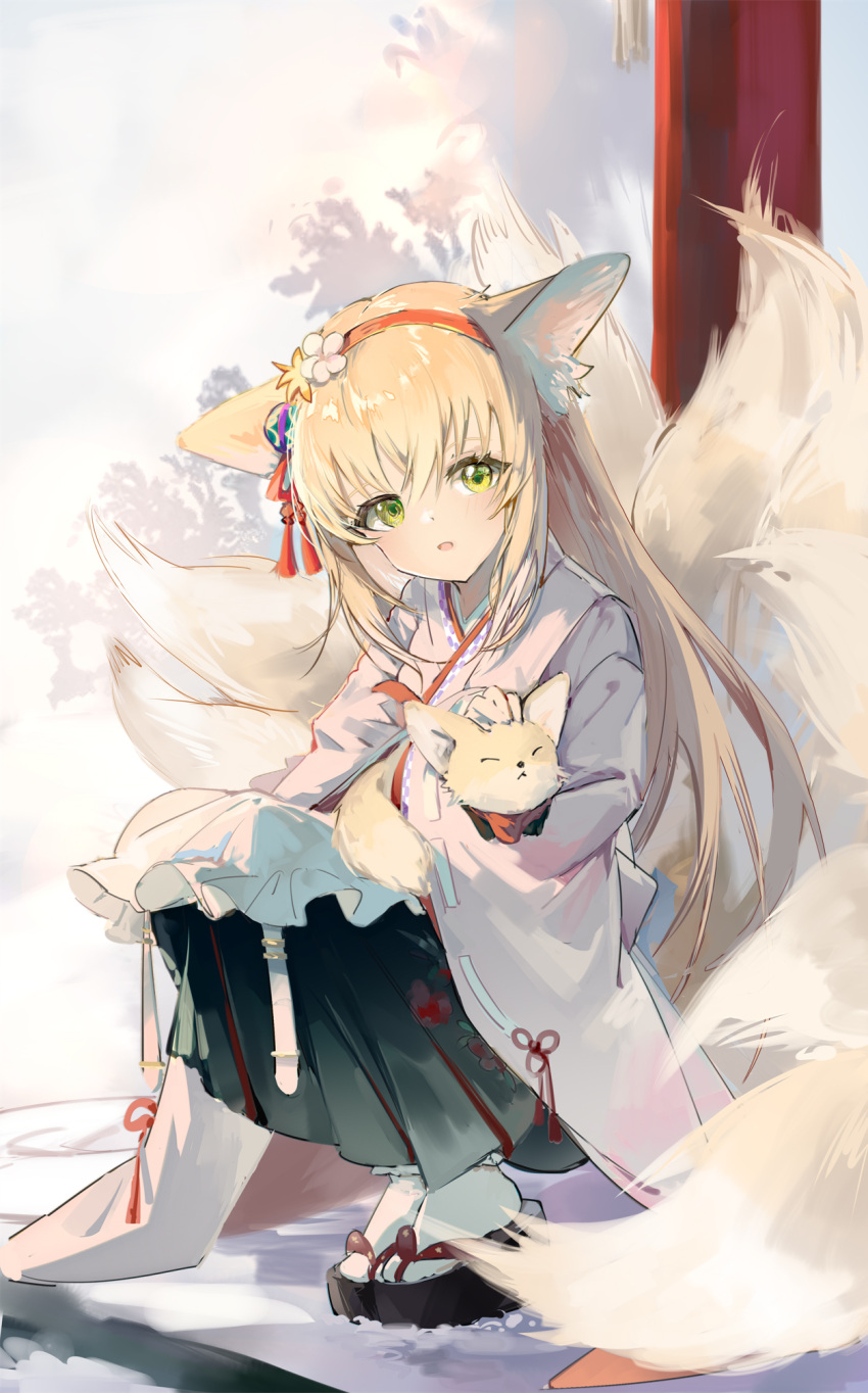 animal, animal_ears, apron, arknights, black_hakama, blonde_hair, flower, fox, fox_ears, fox_girl, fox_tail, frilled_apron, frills, ginwa_233, green_eyes, hair_flower, hair_ornament, hairband, hakama, hakama_skirt, highres, holding, holding_animal, japanese_clothes, kimono, kitsune, kyuubi, long_sleeves, multiple_tails, okobo, outdoors, parted_lips, petting, pink_kimono, pleated_skirt, red_hairband, skirt, socks, squatting, suzuran_(arknights), suzuran_(yukibare)_(arknights), tabi, tail, tassel, waist_apron, white_apron, white_socks