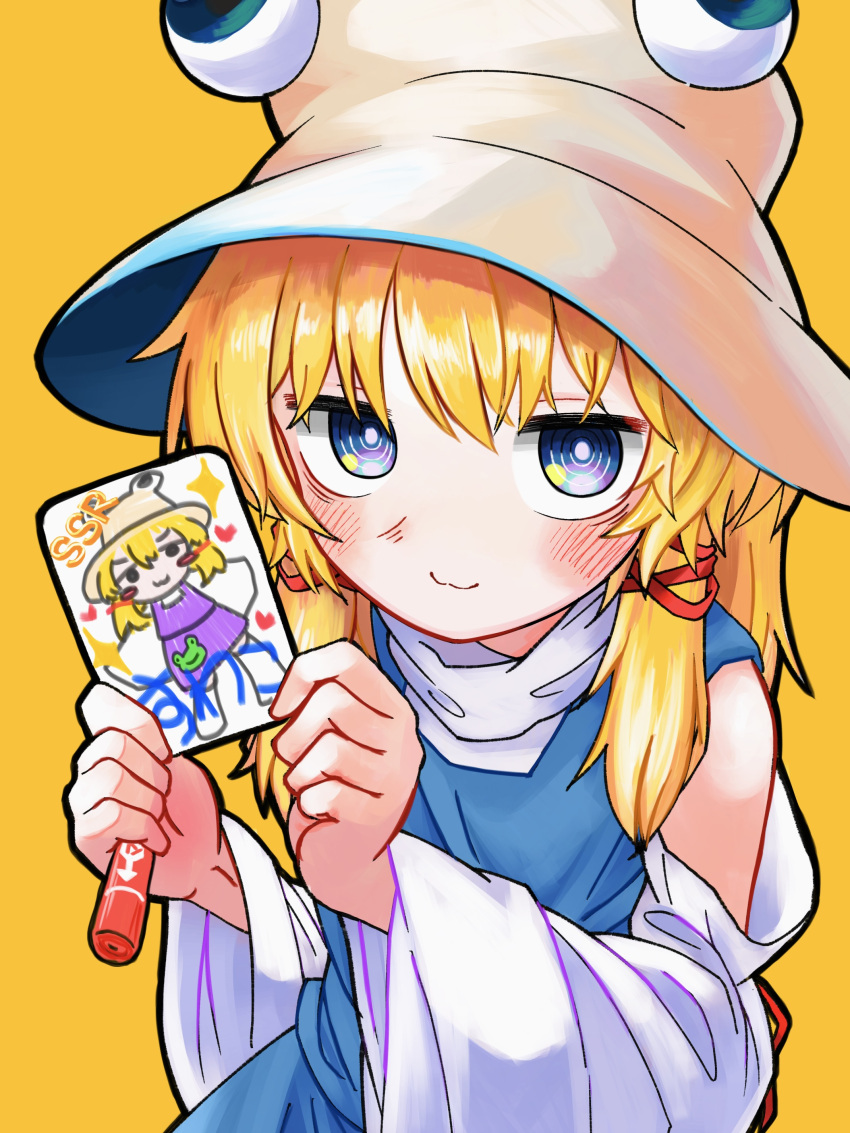1girl, absurdres, animal_print, blonde_hair, blue_vest, card, crayon, dress, frog, frog_hair_ornament, frog_print, grey_eyes, hair_ornament, hat, highres, holding, holding_card, holding_crayon, looking_at_viewer, moriya_suwako, neritch, off-shoulder_dress, off_shoulder, rope, shimenawa, solo, touhou, vest, wide_sleeves, yellow_background