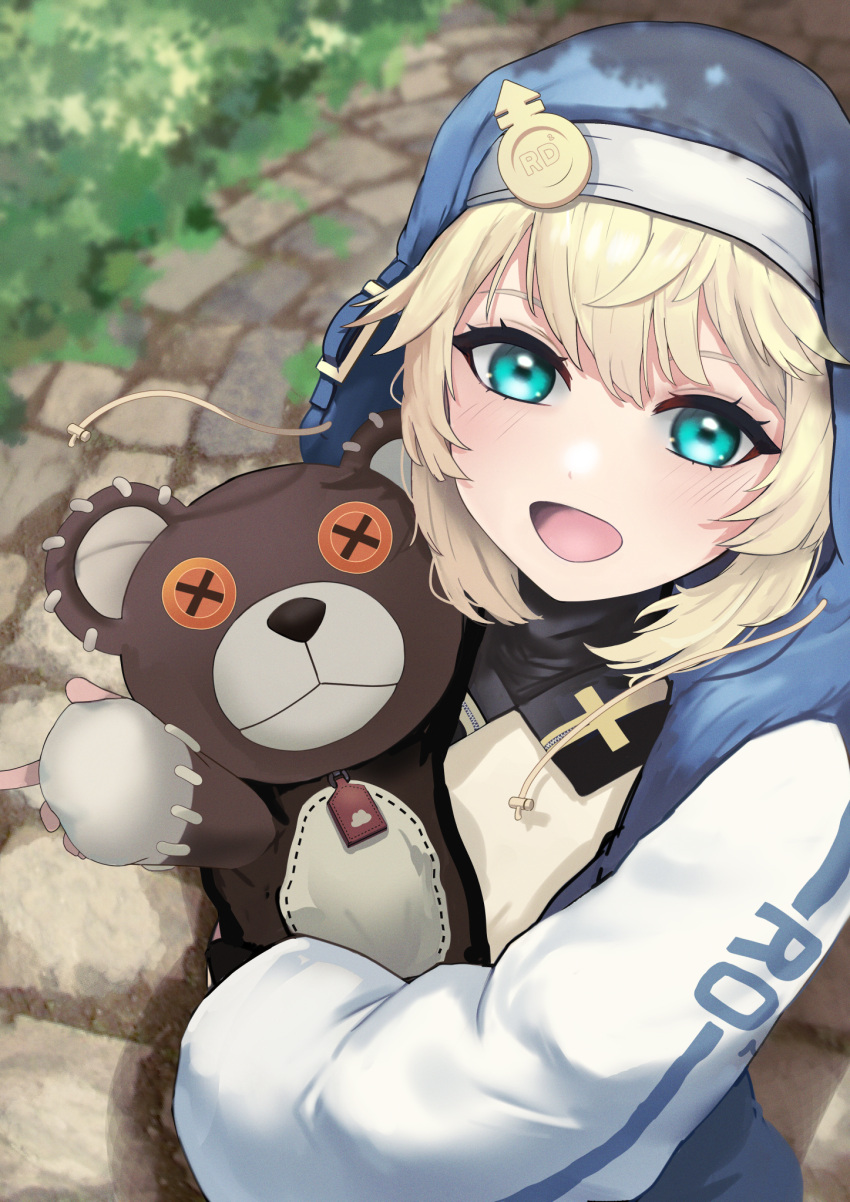 1girl, androgyne_symbol, aqua_eyes, blonde_hair, bridget_(guilty_gear), female_focus, guilty_gear, guilty_gear_strive, habit, highres, hood, hood_up, hooded_jacket, hoodie, jacket, long_sleeves, looking_at_viewer, medium_hair, numaduke, open_clothes, open_hoodie, puffy_long_sleeves, puffy_sleeves, roger_(guilty_gear), smile, stuffed_animal, stuffed_toy, teddy_bear