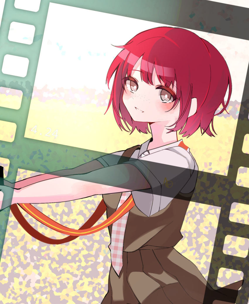 1girl, :d, blurry, blurry_background, blush, bob_cut, breasts, bright_pupils, brown_dress, brown_eyes, camera, commentary, danganronpa_(series), danganronpa_2:_goodbye_despair, depth_of_field, dress, dress_shirt, eyelashes, field, film_strip, freckles, from_side, highres, holding, holding_camera, koizumi_mahiru, komatta_nagito, looking_at_viewer, looking_to_the_side, messy_hair, necktie, outdoors, outstretched_arms, parted_lips, pinafore_dress, plaid_necktie, red_necktie, redhead, school_uniform, shirt, short_hair, short_sleeves, sleeveless, sleeveless_dress, small_breasts, smile, solo, standing, strap, two-tone_necktie, upper_body, very_short_hair, white_necktie, white_pupils, white_shirt, wind