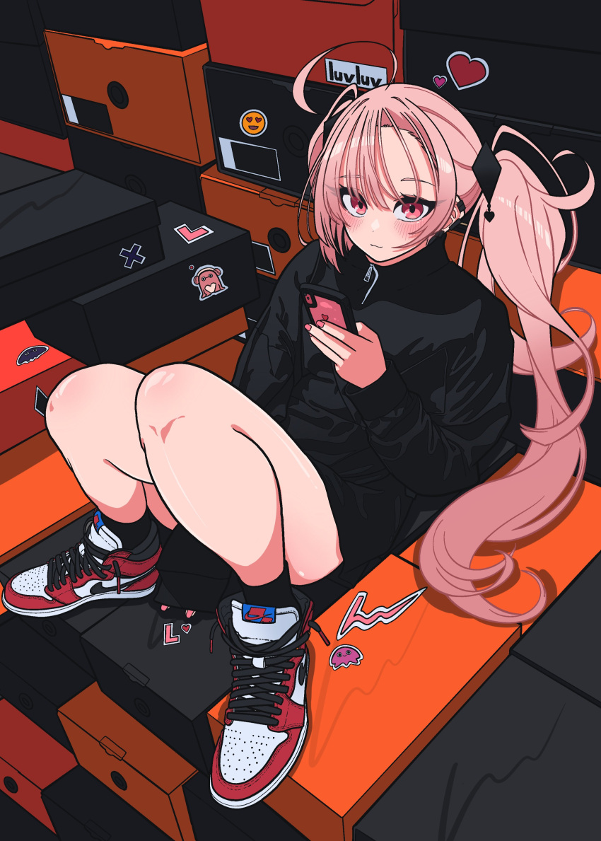 1girl, absurdres, air_jordan, black_jacket, blunt_bangs, blush, ear_piercing, heart, highres, holding, holding_phone, jacket, long_sleeves, looking_at_viewer, luvluvvox, lying, nike, on_back, phone, piercing, pink_eyes, pink_nails, shoe_box, sticker, twintails
