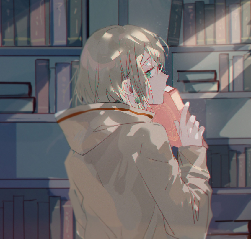 1boy, androgynous, blonde_hair, book, brown_hoodie, earrings, facing_to_the_side, green_eyes