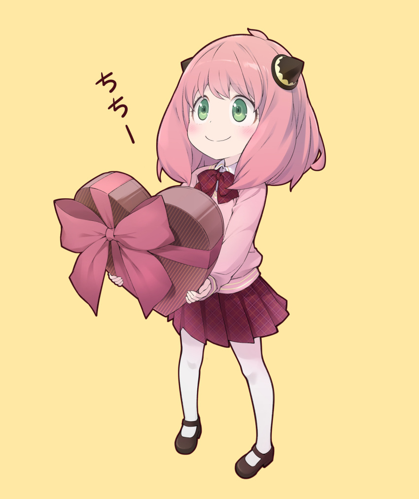 1girl, anya_(spy_x_family), black_footwear, box, full_body, gift, gift_box, green_eyes, hairpods, heart-shaped_box, highres, holding, holding_gift, long_sleeves, pantyhose, pink_hair, pleated_skirt, sakana_(flame_sakana), simple_background, skirt, smile, solo, spy_x_family, standing, valentine, white_pantyhose, yellow_background