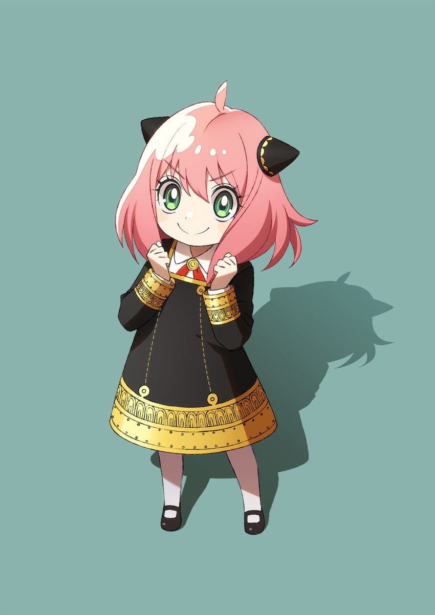 1girl, ahoge, anya_(spy_x_family), aqua_background, black_dress, black_footwear, clenched_hands, closed_mouth, collared_shirt, cross_tie, dress, eden_academy_school_uniform, female_child, full_body, gold_trim, green_eyes, hair_between_eyes, hairpods, highres, long_sleeves, looking_at_viewer, mary_janes, medium_hair, necktie, pantyhose, pink_hair, red_necktie, school_uniform, shirt, shirt_under_dress, shoes, smile, solo, spy_x_family, standing, tomaty., v-shaped_eyebrows, white_pantyhose, white_shirt