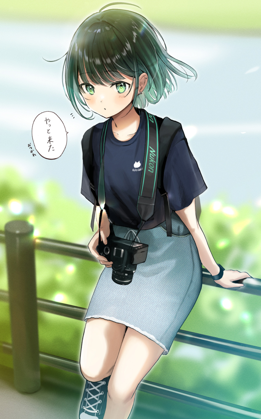 1girl, :o, against_fence, ahoge, black_shirt, blunt_bangs, blurry, blurry_background
