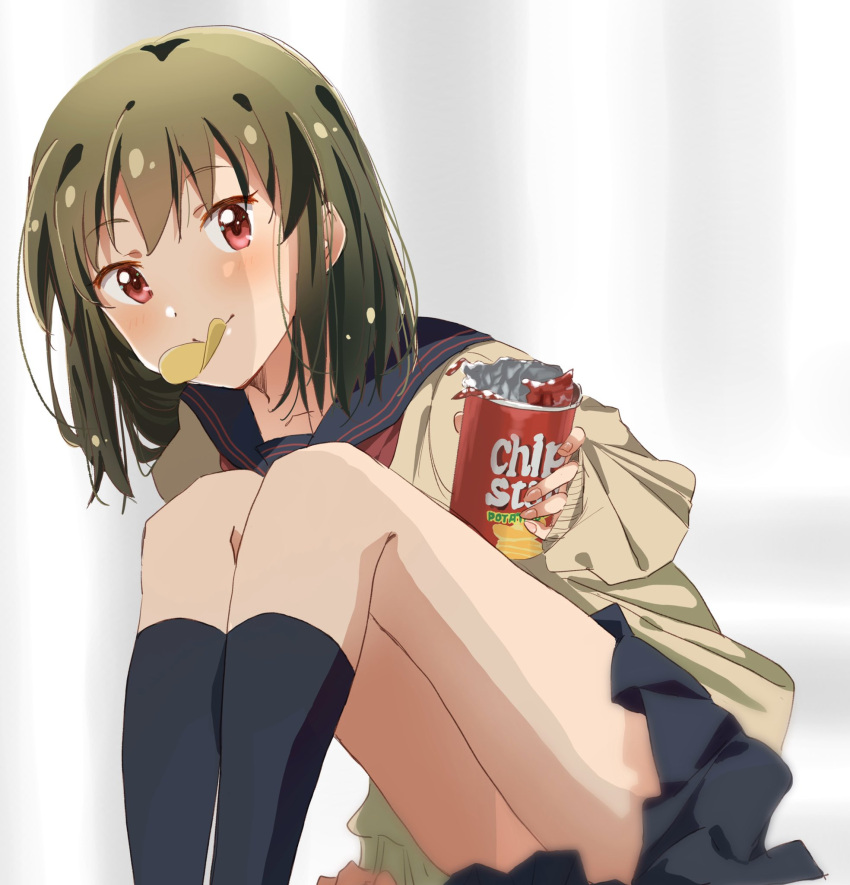 1girl, arm_support, black_sailor_collar, black_skirt, black_socks, blurry, blurry_background, blush, breasts, brown_cardigan, cardigan, chip_star, chips_(food), collarbone, dot_nose, food, green_hair, hand_up, highres, holding_snack, ichigo_(berryberry_19), idolmaster, idolmaster_million_live!, idolmaster_million_live!_theater_days, knees_up, leaning_forward, long_sleeves, looking_at_viewer, mouth_hold, nagayoshi_subaru, neckerchief, pleated_skirt, potato_chips, reaching, reaching_towards_viewer, red_eyes, red_neckerchief, sailor_collar, school_uniform, serafuku, short_hair, sitting, skirt, sleeves_past_wrists, small_breasts, smile, socks, solo, white_background