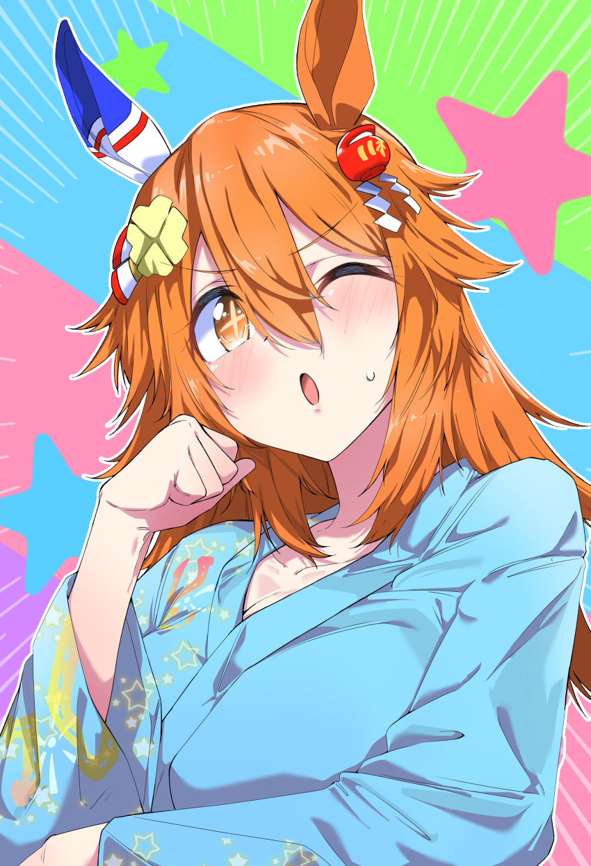 +_+, 1girl, absurdres, alternate_costume, alternate_hairstyle, animal_ears, blue_kimono, centre_ondo_kimono_(umamusume), clenched_hand, clover_hair_ornament, commentary_request, daruma_doll, ear_covers, hair_between_eyes, hair_ornament, highres, horse_ears, horse_girl, japanese_clothes, kimono, long_hair, long_sleeves, looking_at_viewer, matikanefukukitaru_(umamusume), multicolored_background, nerukichikatafukuma, one_eye_closed, open_mouth, orange_eyes, orange_hair, single_ear_cover, solo, umamusume, upper_body