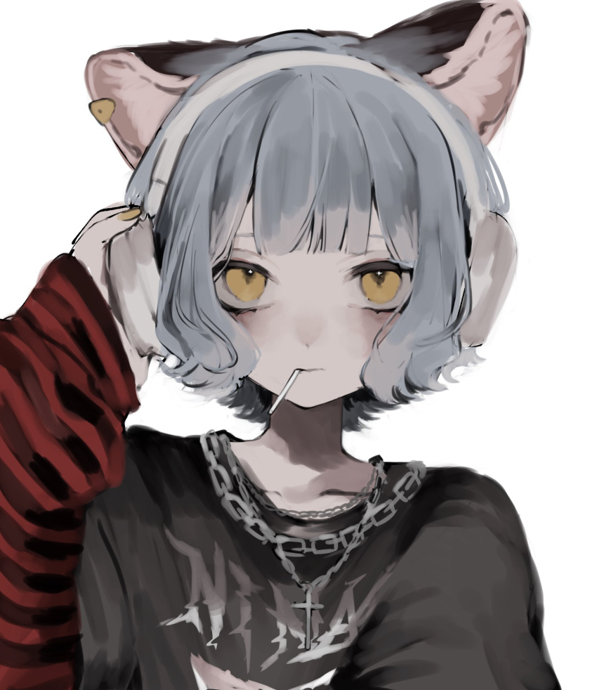 1girl, alternate_costume, animal_ears, black_shirt, candy, cat_ears, chain_necklace, character_name, commentary, cross, cross_necklace, earclip, expressionless, food, food_in_mouth, grey_hair, hand_on_headphones, hand_up, headphones, highres, jewelry, layered_sleeves, lollipop, long_sleeves, looking_at_viewer, manuka_x_x, necklace, nina_(valis), one-hour_drawing_challenge, print_shirt, red_sleeves, shirt, short_hair, short_over_long_sleeves, short_sleeves, sinsekai_studio, solo, striped_sleeves, text_print, upper_body, valis_(sinsekai), white_background, yellow_eyes