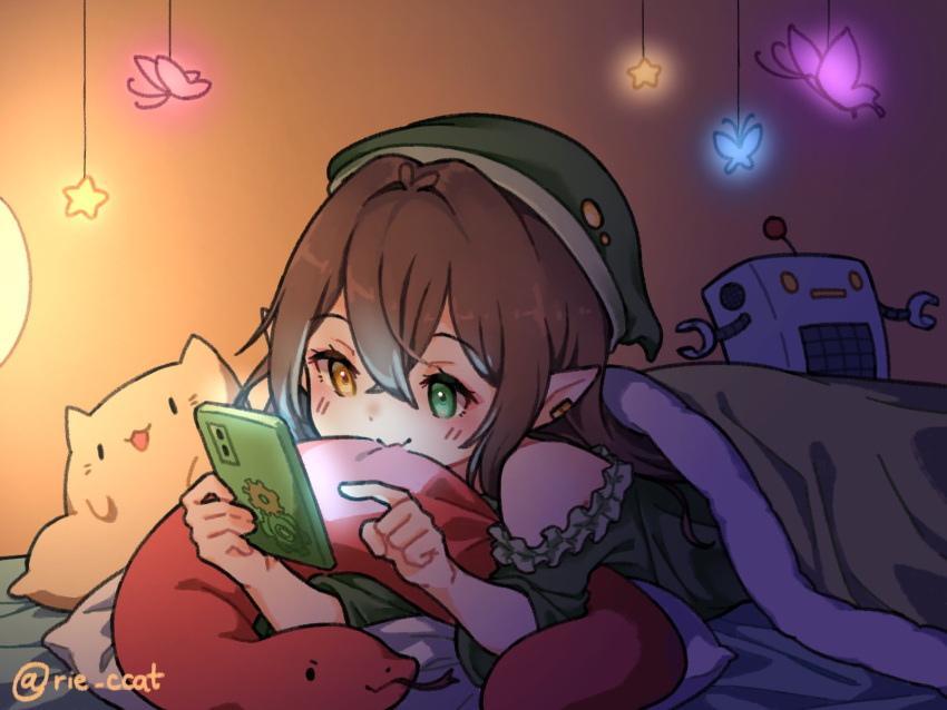 animal-shaped_pillow, blanket, brown_hair, cellphone, green_blanket, green_headwear, green_nightgown, hat