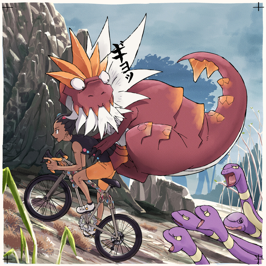 1boy, @_@, bicycle, black_eyes, black_hair, black_shirt, border, commentary_request, dark-skinned_male, dark_skin, day, ekans, from_side, grant_(pokemon), hair_ornament, highres, how_long, looking_back, male_focus, open_mouth, orange_shorts, outdoors, pokemon, pokemon_(creature), pokemon_on_back, pokemon_xy, riding, riding_bicycle, rock, shirt, shoes, short_hair, shorts, snake, tyrantrum, white_border, white_footwear