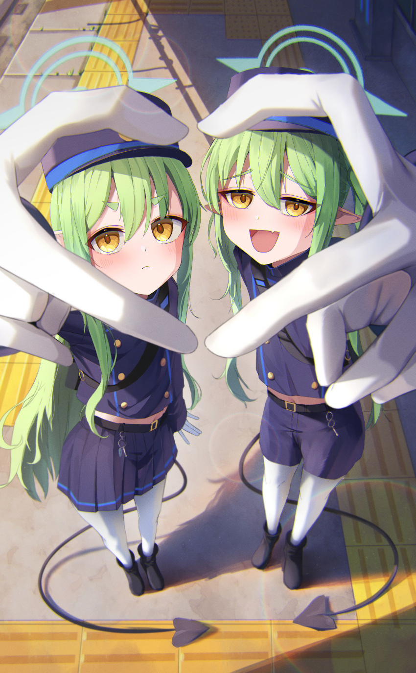 2girls, absurdres, arm_behind_back, arm_up, belt, black_belt, blue_archive, blue_halo, blue_jacket, blue_shorts, blue_skirt, blush, buttons, cropped_jacket, curly_hair, day, demon_girl, demon_tail, double-breasted, expressionless, fang, from_above, full_body, gloves, green_hair, green_halo, hair_between_eyes, half-closed_eyes, halo, hat, heart, heart_hands, heart_hands_duo, highres, hikari_(blue_archive), jacket, light_frown, looking_at_viewer, looking_up, midriff, midriff_peek, miniskirt, multiple_girls, navel, nozomi_(blue_archive), outdoors, pantyhose, pita_goral, pleated_skirt, reaching, reaching_towards_viewer, short_shorts, shorts, siblings, sisters, skin_fang, skirt, smug, standing, staring, tactile_paving, tail, thick_eyebrows, train_station, train_station_platform, twins, twintails, white_gloves, yellow_eyes