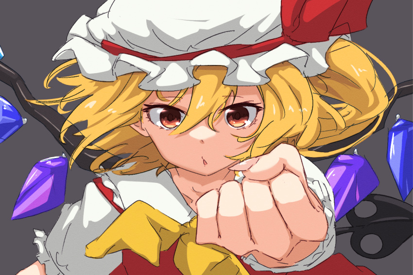 1girl, ascot, blonde_hair, clenched_hand, collared_shirt, commentary_request, flandre_scarlet, grey_background