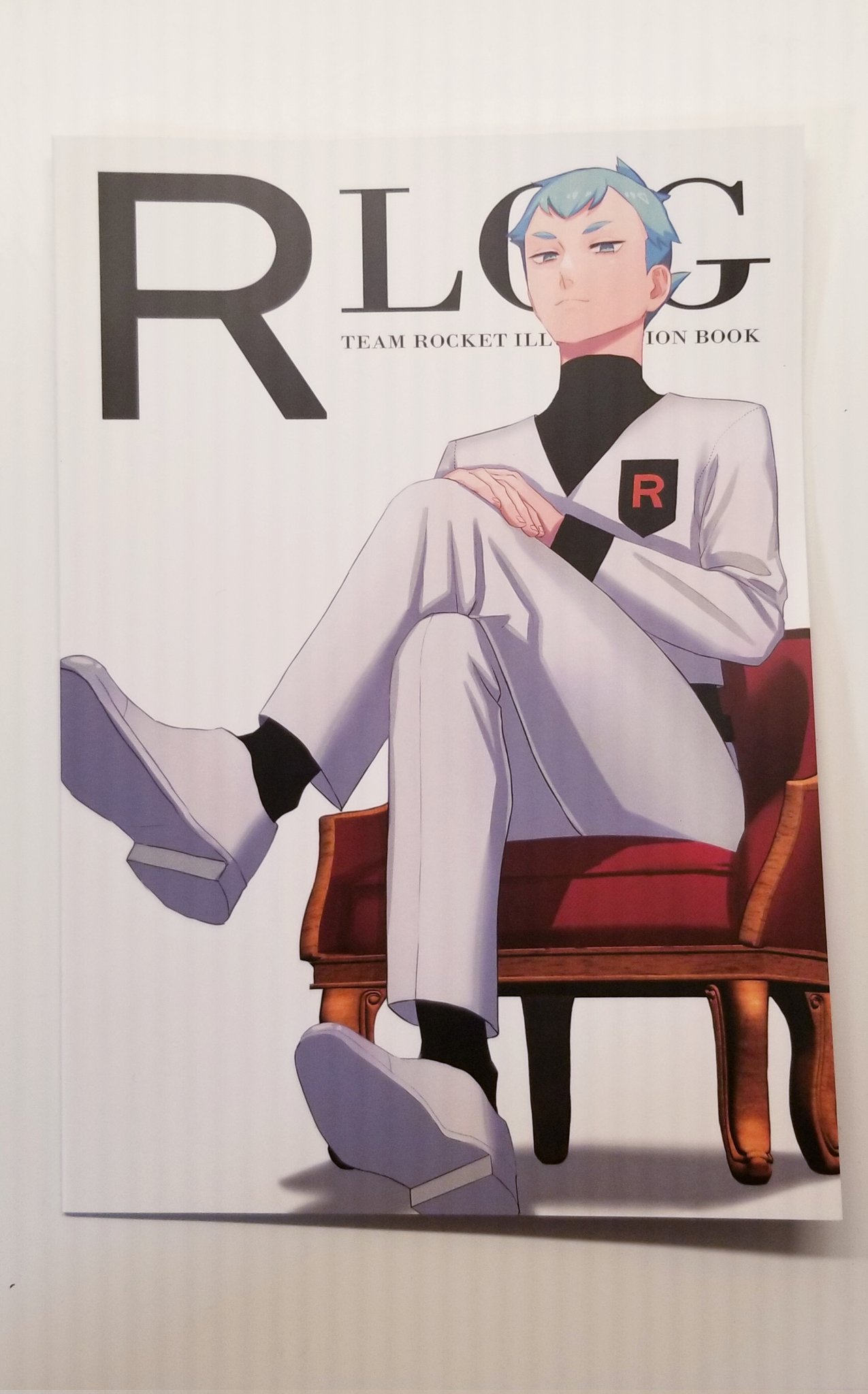 1boy, archer_(pokemon), chair, closed_mouth, commentary_request, crossed_legs, delta_nonbiri, highres