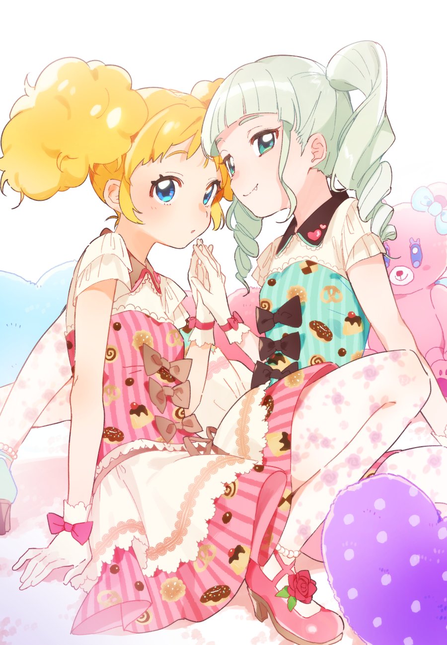 2girls, :o, aikatsu!, aikatsu!_(series), arm_at_side, bed, blonde_hair, blue_eyes, blunt_bangs, blush, booota, bow, brown_bow, dress, dress_bow, drill_hair, fang, floral_print, food_print, gloves, green_dress, green_eyes, hand_on_ground, hand_up, heart, heart-shaped_pillow, highres, holding_hands, idol, medium_dress, medium_hair, multiple_girls, on_bed, pantyhose, pillow, pink_bow, pink_dress, saegusa_kii, short_sleeves, sitting, smile, stuffed_animal, stuffed_toy, todo_yurika, twin_drills, twintails, white_background, white_gloves, white_hair, white_pantyhose, wrist_bow