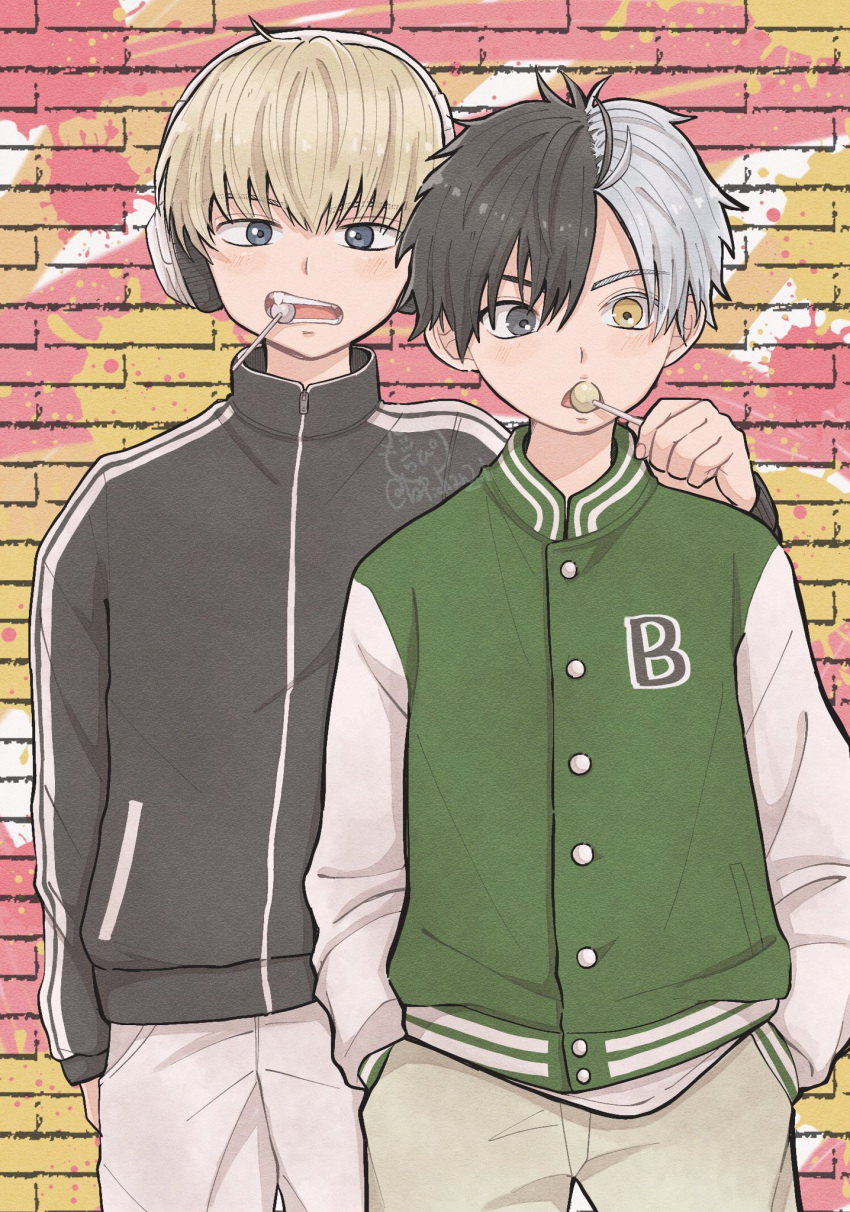2boys, black_hair, blonde_hair, brick_wall, candy, food, hands_in_pockets, headphones