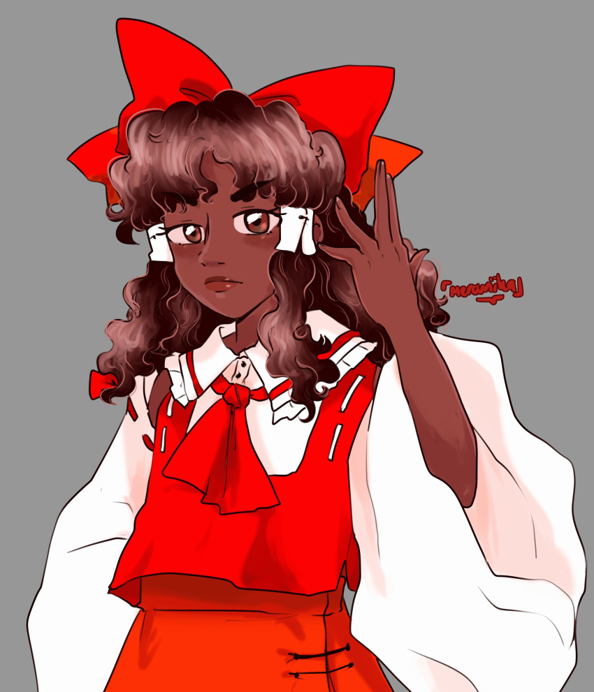 1girl, absurdres, alternate_skin_color, ascot, blacktober, bow, brown_eyes, brown_hair, curly_hair, dark-skinned_female, dark_skin, detached_sleeves, hair_bow, hair_tubes, hakurei_reimu, highres, long_hair, mercuriika, red_bow, ribbon, simple_background, skirt, solo, touhou, twitter_username