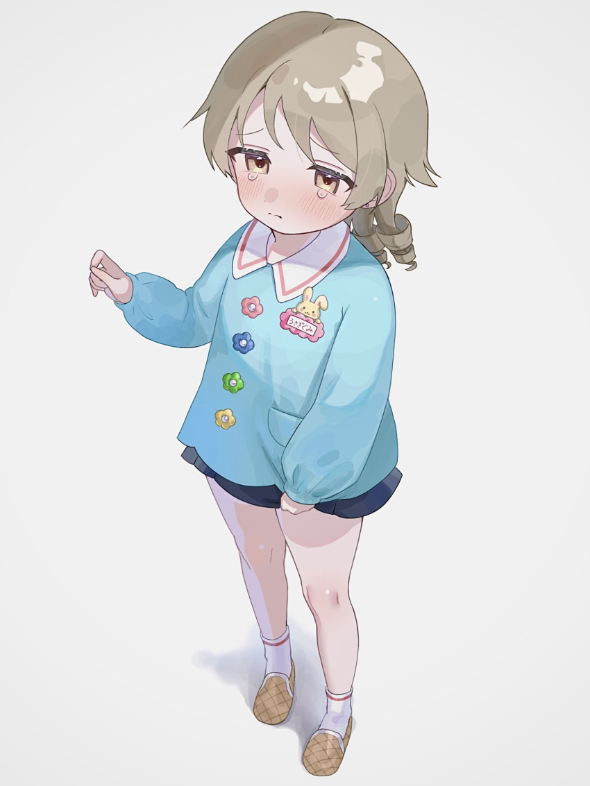 1girl, badge, blue_shirt, blue_skirt, blush, brown_eyes, button_badge, closed_mouth