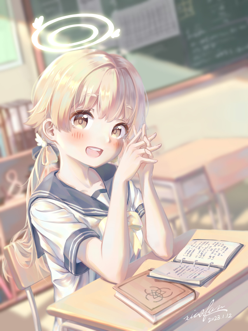 1girl, :d, absurdres, artist_name, blonde_hair, blue_archive, blurry, blurry_background, blush, book, bookshelf, chalkboard, classroom, dated, desk, halo, hifumi_(blue_archive), highres, indoors, open_book, own_hands_together, ponytail, school_desk, school_uniform, serafuku, shirt, short_sleeves, sitting, smile, white_shirt, xiaofan2005