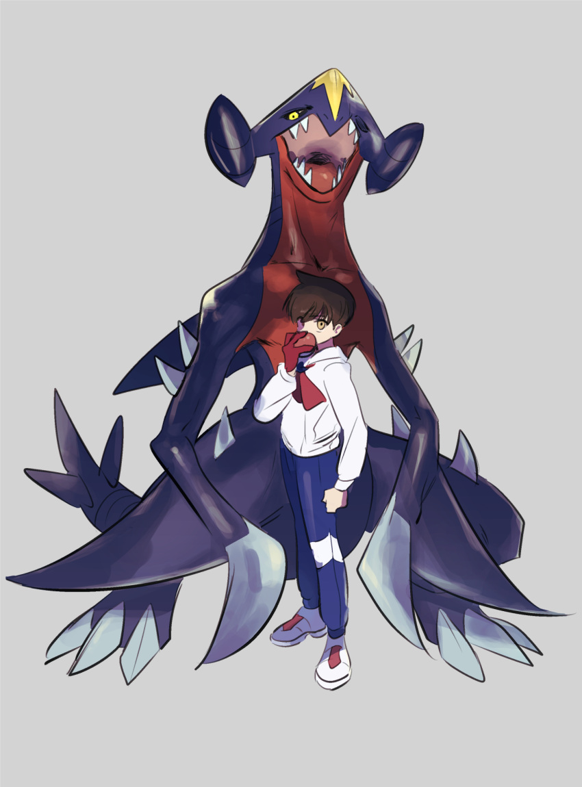 1boy, assassinookayu, blue_pants, brown_hair, fangs, florian_(pokemon), garchomp, grey_background, highres, hood, hoodie, looking_at_viewer, male_focus, open_mouth, pants, poke_ball, pokemon, pokemon_(creature), white_footwear, white_hoodie, yellow_eyes