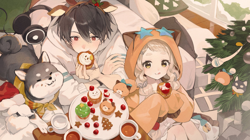 1boy, 1girl, :q, absurdres, alternate_costume, animal_ear_hairband, animal_ear_hood, animal_ears, black_dog, blonde_hair, blue-tinted_eyewear, braid, brown_hair, closed_mouth, commentary, cup, cupcake, dog, dot_nose, drawstring, eating, fake_animal_ears, food, gingerbread_cookie, gonzalez_(machita_chima), hair_between_eyes, hair_over_shoulder, hairband, hamster, highres, holding, holding_food, hood, hood_down, hood_up, hoodie, iv_4t, jacket, kokumucho_(nijisanji), kuroi_shiba, licking_lips, light_blush, long_bangs, lying, machita_chima, machita_chima_(3rd_costume), nijisanji, official_alternate_hairstyle, on_stomach, orange_jacket, plate, red_eyes, sleeves_past_elbows, sleeves_past_fingers, sleeves_past_wrists, star-shaped_eyewear, star_(symbol), symbol-only_commentary, thick_eyebrows, tinted_eyewear, tongue, tongue_out, twin_braids, virtual_youtuber, white_hoodie, yellow_eyes