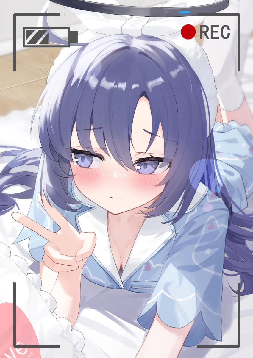 1girl, absurdres, averting_eyes, battery_indicator, blue_archive, blush, chinese_commentary, closed_mouth, commentary_request, facing_viewer, highres, indoors, long_hair, luo_shu, lying, no_shoes, on_stomach, pajamas, purple_hair, recording, sideways_glance, socks, solo, v, viewfinder, violet_eyes, white_socks, yuuka_(blue_archive)
