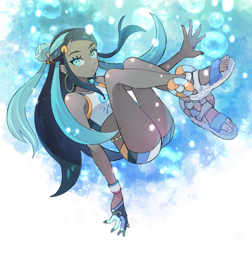1girl, belly_chain, black_hair, blue_background, blue_eyes, blue_eyeshadow, blue_hair, crop_top, dark-skinned_female, dark_skin, dynamax_band, earrings, eyeshadow, full_body, gloves, hair_bun, highres, hoop_earrings, jewelry, long_hair, looking_at_viewer, makeup, multicolored_hair, necklace, nessa_(pokemon), oniwa, pokemon, pokemon_swsh, pool_float, sandals, shoes, simple_background, single_glove, single_hair_bun, solo, two-tone_hair, white_shoes