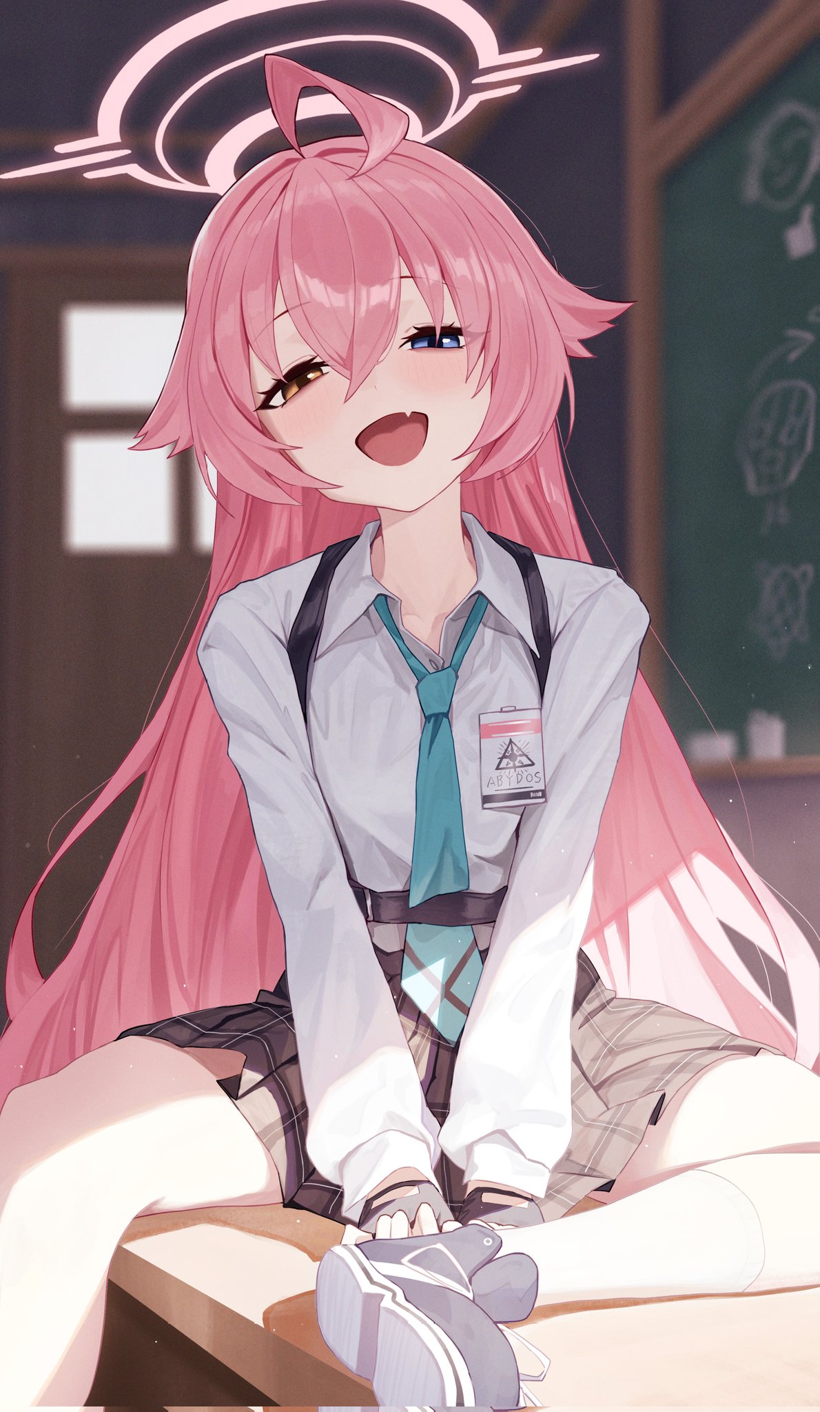 1girl, :d, abydos_high_school_logo, ahoge, black_gloves, black_skirt, blue_archive, blue_eyes, blue_necktie, blush, chalkboard, classroom, collared_shirt, commentary_request, desk, eyelashes, fang, film_grain, fingerless_gloves, foot_out_of_frame, gloves, grey_shoes, half-closed_eyes, halo, happy, heterochromia, highres, hoshino_(blue_archive), id_card, indoors, long_hair, long_sleeves, looking_at_viewer, miniskirt, necktie, on_desk, open_mouth, pink_hair, pink_halo, plaid_clothes, plaid_skirt, pleated_skirt, renaya41078728, school_uniform, shirt, shoes, sitting, skin_fang, skirt, smile, sneakers, solo, v_arms, very_long_hair, white_shirt, yellow_eyes