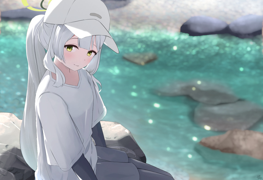 1girl, absurdres, baseball_cap, black_pantyhose, black_shirt, black_shorts, blue_archive, blush, commentary_request, day, feet_out_of_frame, from_side, ganba_artworks, green_eyes, green_halo, hair_between_eyes, halo, hare_(blue_archive), hare_(camp)_(blue_archive), hat, highres, layered_sleeves, long_hair, long_sleeves, looking_at_viewer, outdoors, pantyhose, ponytail, river, rock, shirt, short_over_long_sleeves, short_sleeves, shorts, sidelocks, smile, solo, v-neck, water, white_hat, white_shirt