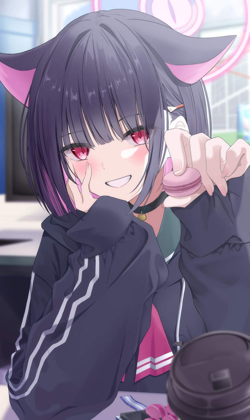 1girl, absurdres, animal_ears, black_choker, black_hair, black_hoodie, blue_archive, blush, cat_choker, cat_ears, cat_girl, choker, colored_inner_hair, cup, disposable_coffee_cup, disposable_cup, food, green_sailor_collar, grin, hair_ornament, hairclip, halo, hand_on_own_face, highres, holding, holding_food, holding_macaron, hood, hoodie, incoming_food, kazusa_(blue_archive), long_sleeves, looking_at_viewer, macaron, multicolored_hair, nano12xx5, pink_hair, pink_halo, red_eyes, sailor_collar, short_hair, sleeves_past_wrists, smile, solo, upper_body