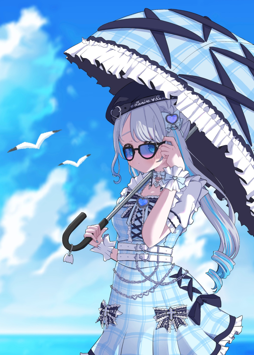 1girl, adjusting_eyewear, belt, bird, black_hat, blue_eyes, blue_gemstone, blue_hair, blue_sky, blue_umbrella, blush, bow, buckle, center_frills, choker, cowboy_shot, dress, frilled_choker, frilled_umbrella, frilled_wrist_cuffs, frills, gem, grey_hair, hair_bow, hat, heart, heart-shaped_buckle, highres, holding, holding_umbrella, horizon, kaga_sumire, kaga_sumire_(7th_costume), lace-trimmed_bow, lace_trim, long_hair, lupinus_virtual_games, multicolored_hair, multiple_belts, plaid_clothes, plaid_dress, plaid_umbrella, s_gunung_s, seagull, short_sleeves, sky, solo, streaked_hair, sunglasses, tinted_eyewear, twintails, umbrella, virtual_youtuber, vspo!, wallet_chain, white_belt, wrist_bow, wrist_cuffs