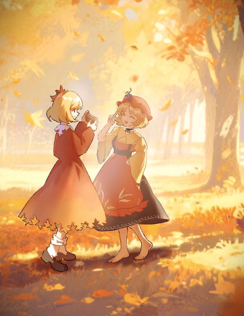 2girls, absurdres, aki_minoriko, aki_shizuha, apron, barefoot, blonde_hair, camera, closed_eyes, dress, forest, grape_hat_ornament, hat, highres, holding, holding_camera, leaf, maple_leaf, multiple_girls, nature, outdoors, red_apron, red_dress, red_hat, shirt, short_hair, smile, taking_picture, touhou, v, wide_sleeves, xinbuqing, yellow_shirt