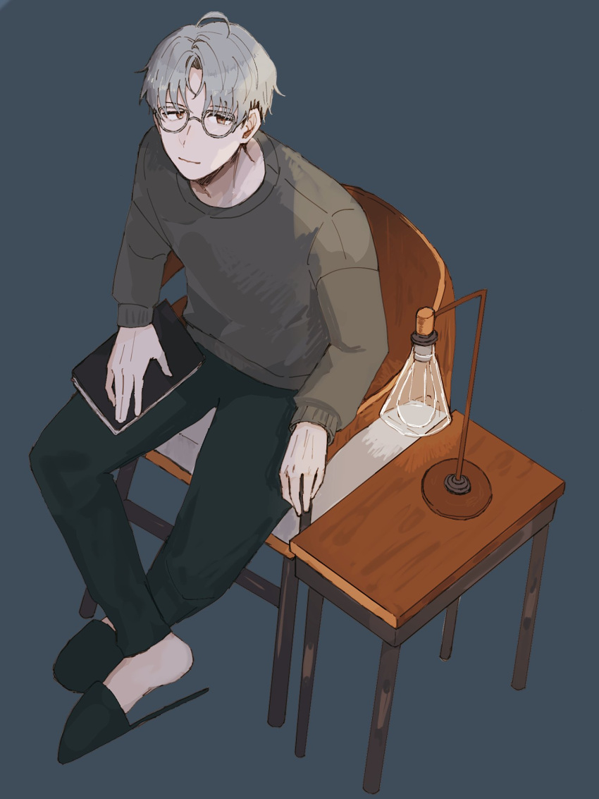 1boy, black_pants, black_slippers, book, brown_eyes, chair, closed_mouth, curtained_hair, desk_lamp, from_above, full_body, galiumnightride, glasses, grey-framed_eyewear, grey_background, grey_hair, grey_sweater, highres, hitotsubashi_ayato, hitotsubashi_ayato_(2nd_costume), holding, holding_book, lamp, long_sleeves, looking_at_viewer, male_focus, nijisanji, on_chair, pants, short_hair, simple_background, sitting, slippers, solo, sweater, table, undercut, virtual_youtuber