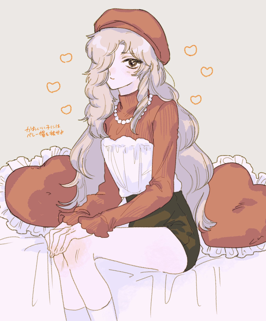 173_mkt, 1boy, alternate_costume, bed, bed_sheet, beret, black_shorts, blonde_hair, blush, brown_eyes, commentary_request, crossdressing, crossdressing_(mtf), curly_hair, curtained_hair, feet_out_of_frame, fingernails, frilled_pillow, frilled_sleeves, frills, from_side, grey_background, hair_over_one_eye, hands_on_own_knees, hat, heart, heart-shaped_pillow, high-waist_shorts, highres, jewelry, knee_blush, layered_shirt, legs_together, long_hair, long_sleeves, looking_at_viewer, loving_aura, male_focus, maraich_juschenfe, necklace, nose_blush, on_bed, parted_bangs, patalliro!, pearl_necklace, pillow, red_hat, red_sweater, ribbed_sweater, shirt, short_shorts, shorts, simple_background, sitting, sleeves_past_wrists, smile, socks, solo, strapless, strapless_shirt, sweater, translation_request, trap, turtleneck, turtleneck_sweater, wavy_hair, white_shirt, white_socks