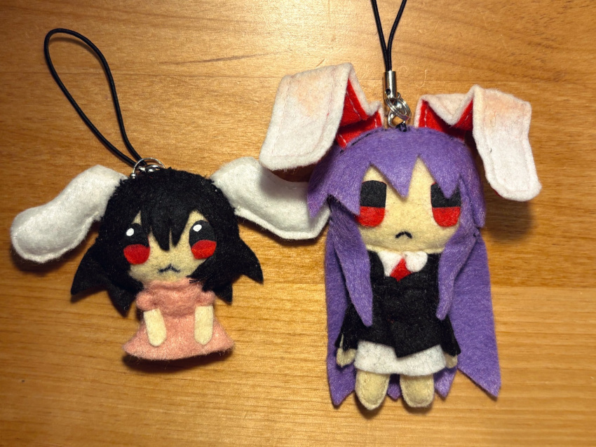 2girls, :3, animal_ears, aoiseshin, black_coat, black_hair, character_doll, charm_(object)