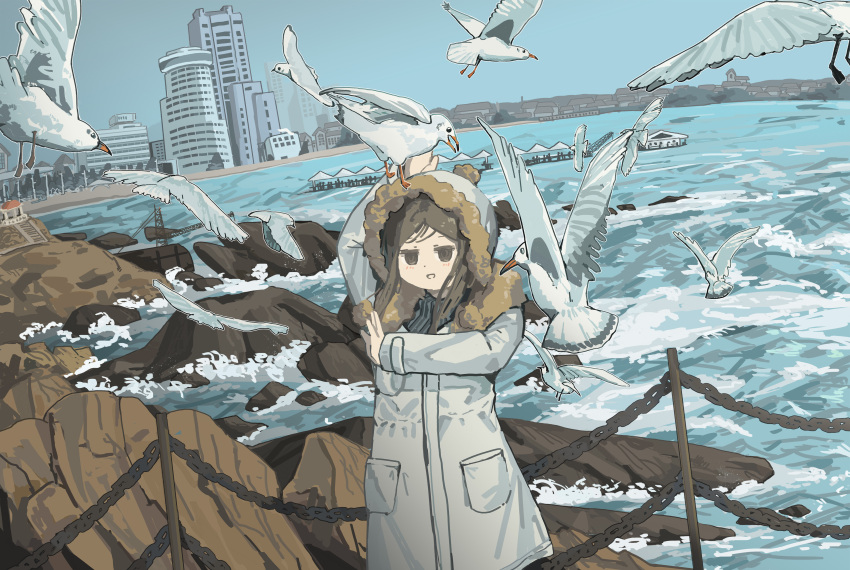 1girl, :d, absurdres, animal_on_head, arm_up, bird, bird_on_head, black_sweater, blush, brown_eyes, brown_hair, brown_trim, building, chain-link_fence, city, cliff, clouds, cloudy_sky, coat, commentary, cowboy_shot, crinoids, day, dot_nose, empty_eyes, fence, fur-trimmed_coat, fur_trim, highres, layered_clothes, light_blush, light_smile, looking_at_viewer, ocean, on_head, open_hands, original, parted_bangs, pocket, rock, scenery, seagull, short_hair, sidelocks, sky, smile, solo, standing, sweater, too_many, too_many_birds, watch, water, waves, white_bird, white_coat