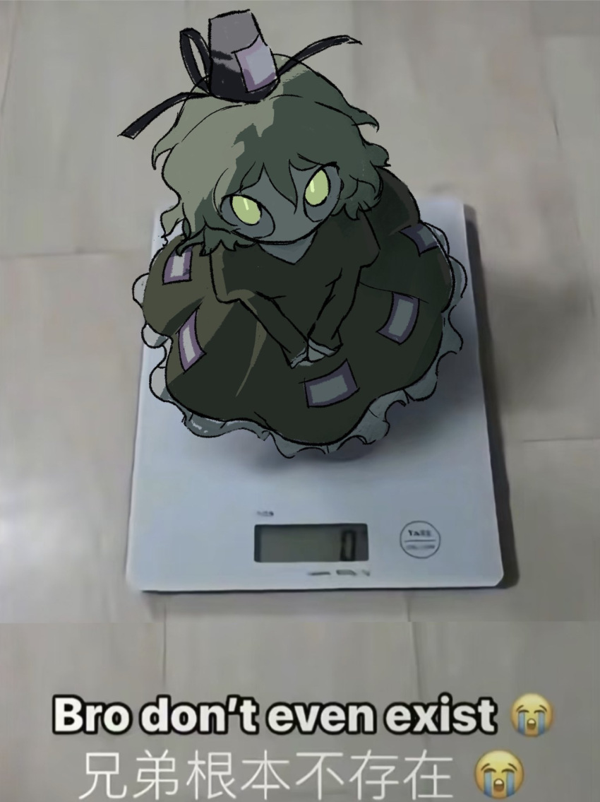 1girl, backlighting, bathroom_scale, caption, chinese_text, crying_emoji, dress, emoji, frilled_dress, frills, from_above, green_dress, green_eyes, green_hair, hat, highres, juliet_sleeves, long_sleeves, looking_at_viewer, medium_hair, mini_person, minigirl, ofuda, ofuda_on_clothes, perro090119, photo_background, puffy_sleeves, shadow, soga_no_tojiko, solo, tate_eboshi, touhou, upturned_eyes, v_arms, weighing_scale