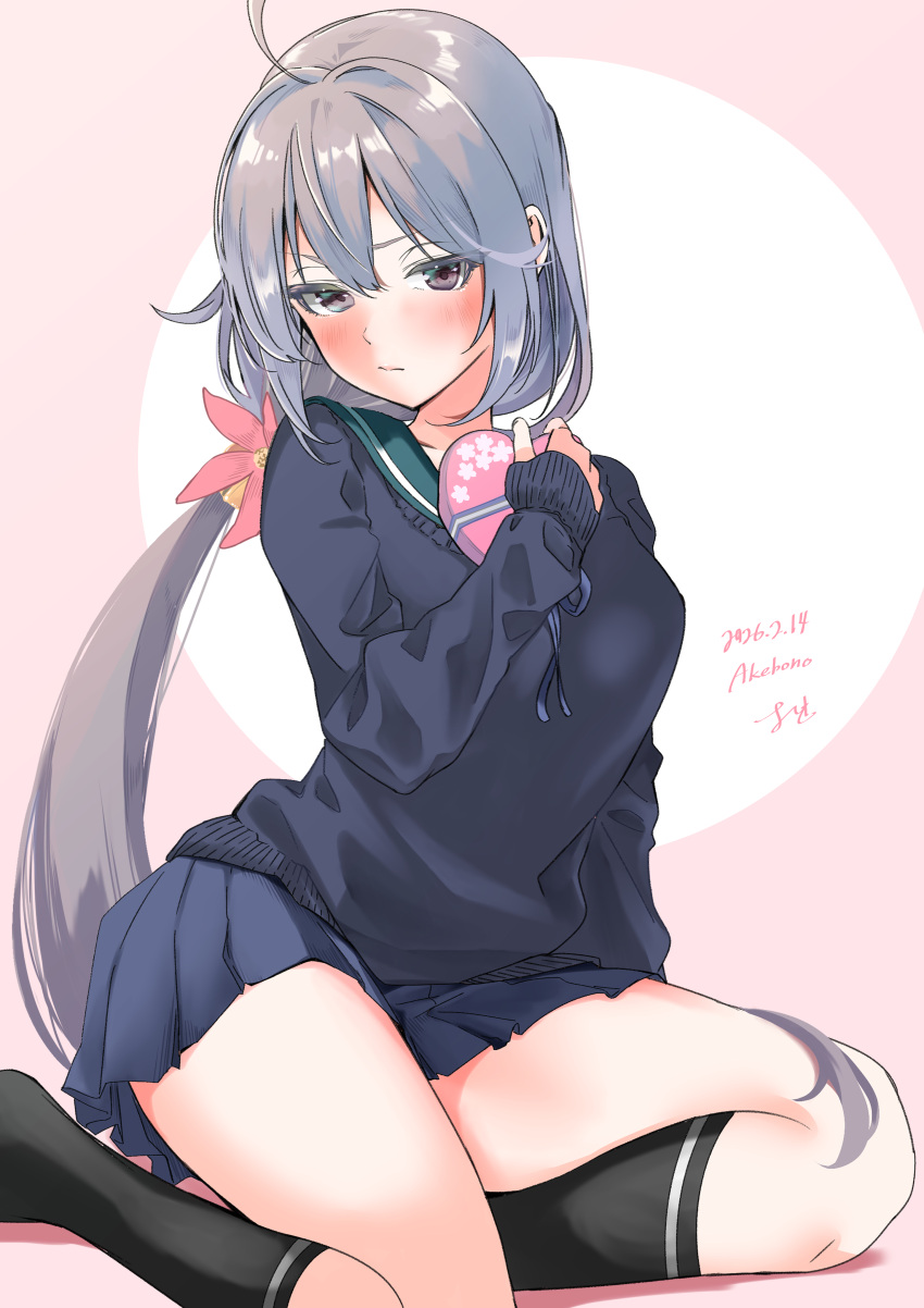 1girl, absurdres, ahoge, akebono_(kancolle), akebono_(valentine)_(kancolle), black_socks, blue_sailor_collar, blue_skirt, blue_sweater, box, character_name, commentary_request, dated, flower, gradient_background, grey_hair, hair_flower, hair_ornament, heart-shaped_box, highres, kantai_collection, looking_at_viewer, pleated_skirt, sailor_collar, school_uniform, serafuku, skirt, socks, solo, sweater, yoshiki_(bpmaxm)
