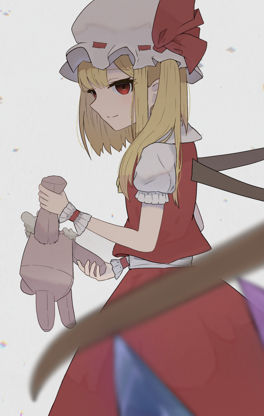 1girl, blonde_hair, blurry, blurry_foreground, closed_mouth, commentary_request, cowboy_shot, crystal_wings