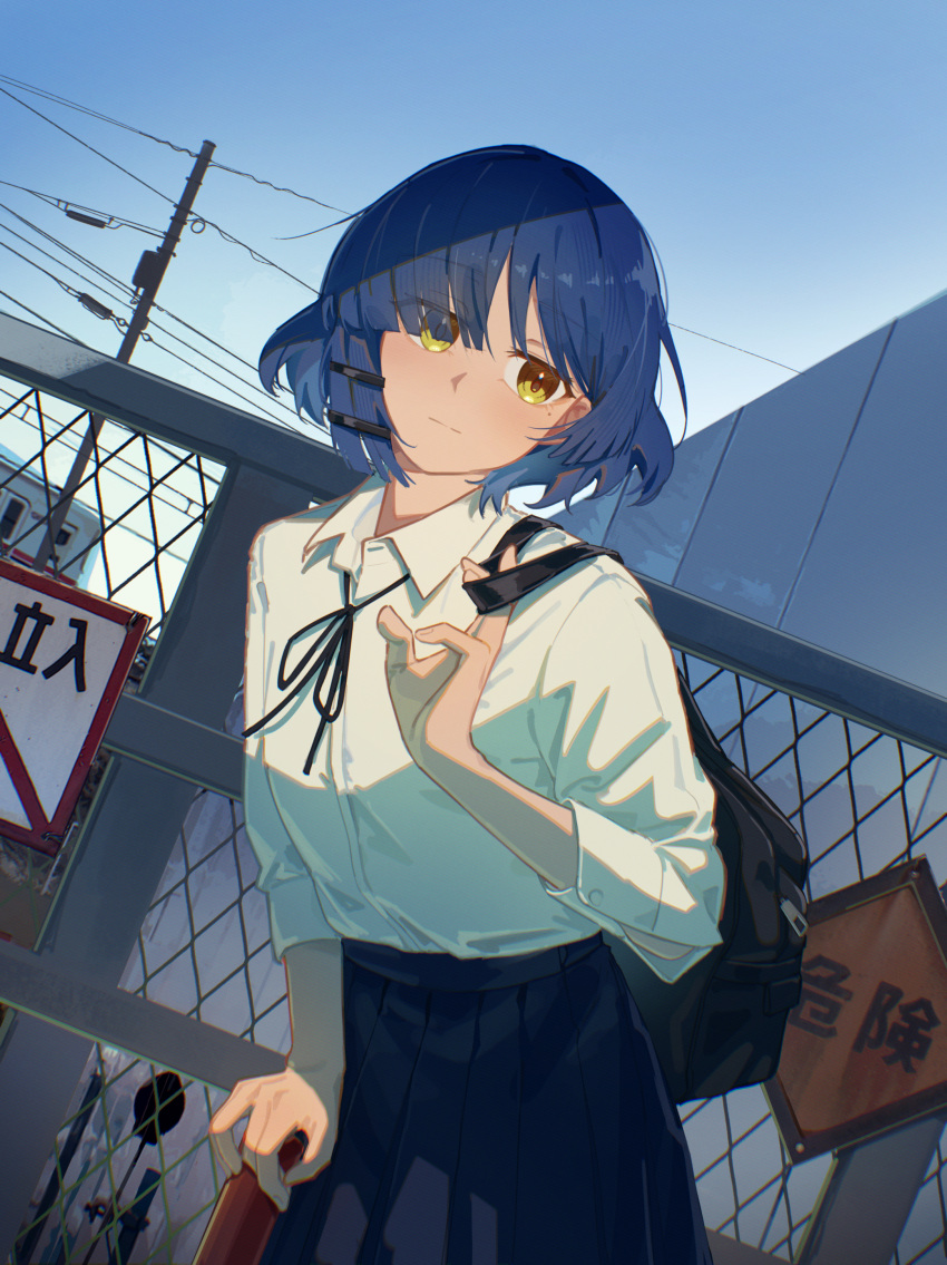 1girl, absurdres, bag, black_bag, black_skirt, blue_hair, blue_sky, bocchi_the_rock!, closed_mouth, collared_shirt, dress_shorts, highres, jl_tan, looking_at_viewer, mole, mole_under_eye, neck_ribbon, outdoors, pleated_skirt, ribbon, school_bag, shirt, sign, skirt, sky, solo, utility_pole, white_shirt, yamada_ryo, yellow_eyes