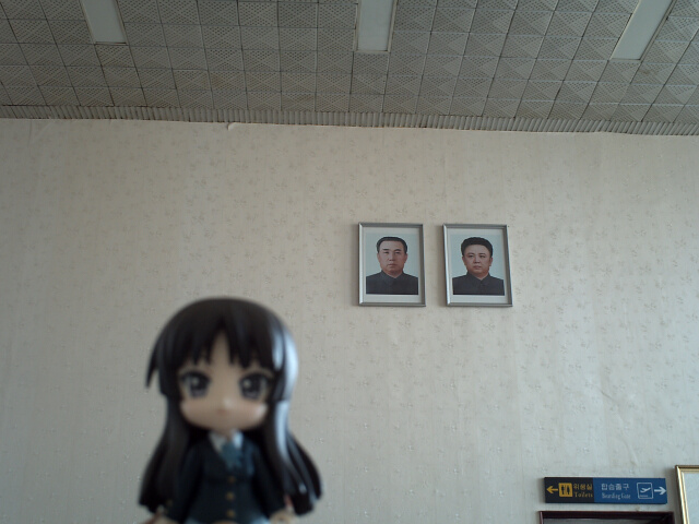 1girl, airport, akiyama_mio, black_eyes, black_hair, blazer, blue_bow, blue_bowtie