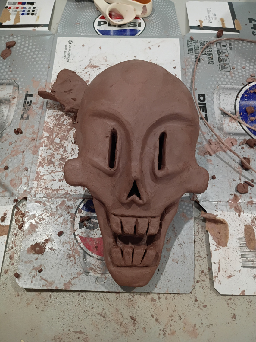 1boy, 2026, absurdres, art_tools_in_frame, boneteaart, clay_(medium), commentary, english_commentary, highres, humanoid, male, male_focus, male_only, monster, monster_boy, papyrus_(undertale), photo_(medium), skeleton, skull, solo, teeth, undead, undertale, unfinished, utdr_(toby_fox)